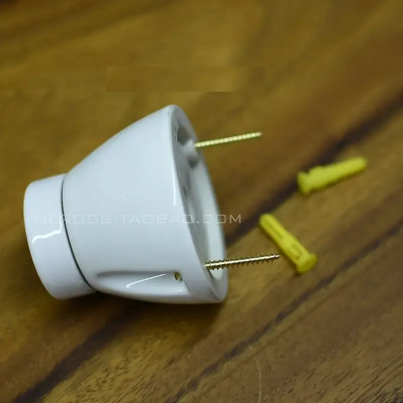 Modern black and white decorbites ceramic e27 lamp bulb holder with two brass screws and yellow wall anchors nearby