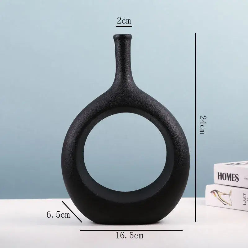 Black ceramic vase with sleek modern design circular opening and slender neck for decorbites ceramic vase set living room decor