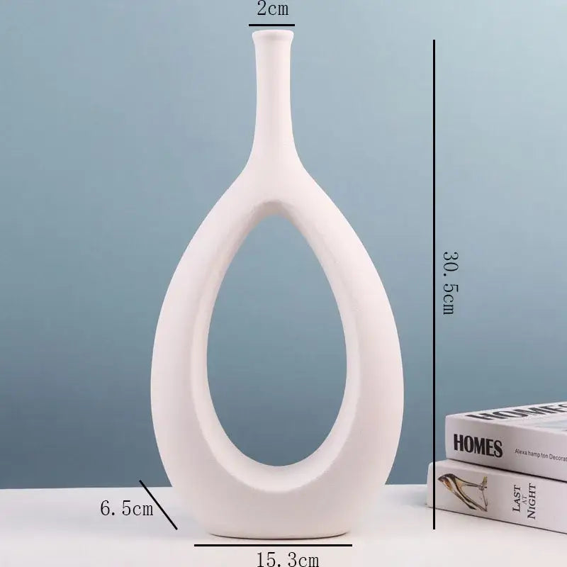 Modern black and white ceramic vase by decorbites with sleek oval cutout and slender neck for living room decor