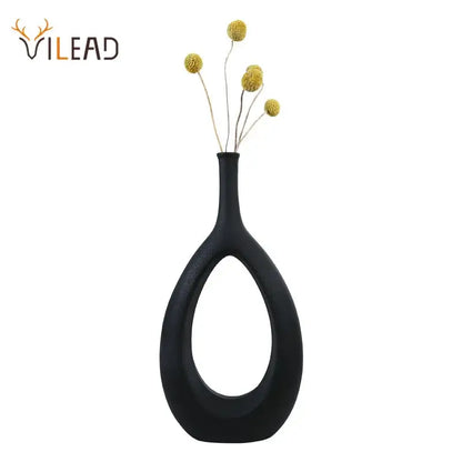 Modern black and white decorbites ceramic vase set featuring a sleek teardrop ceramic vase with central oval cutout