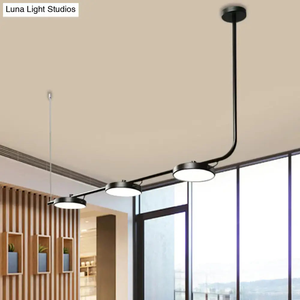 Modern black DecorBites chandelier with three circular LED bulbs on curved arm for dining room lighting with max bulb wattage