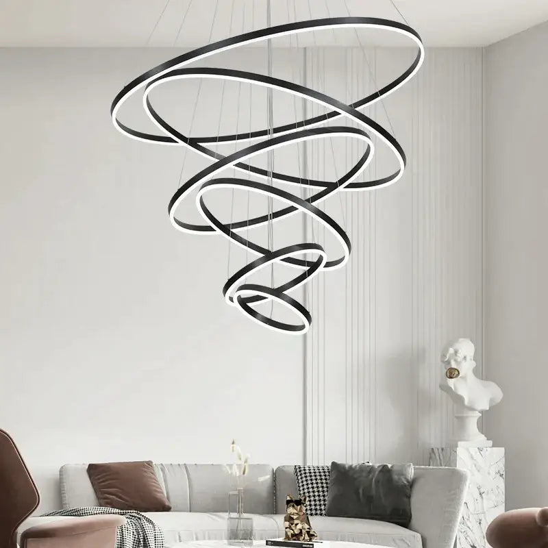 Modern black and white circle ring art chandelier with glowing inner rings for staircase lighting by decorbites circle ring