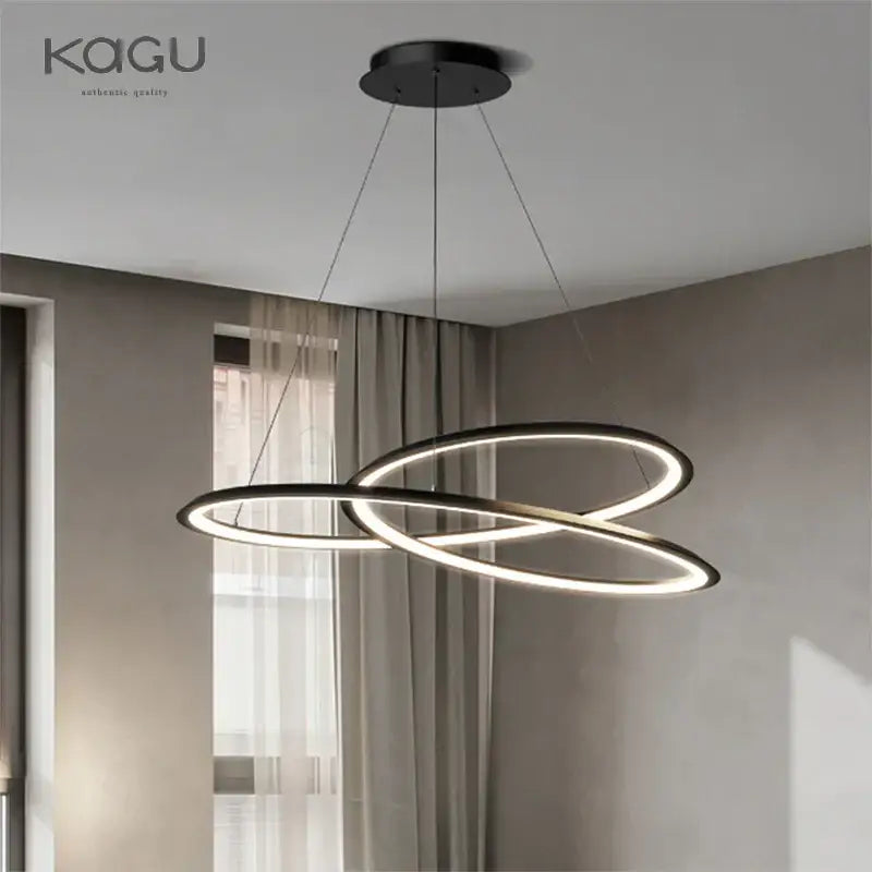 Modern black and white circular LED chandelier with interlocking rings emitting warm light for living room decorbites circular black white