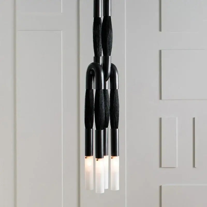 Modern black and white cloth pendant light with sleek curved metal arms and frosted glass shades for kitchen decorbites cloth pendant