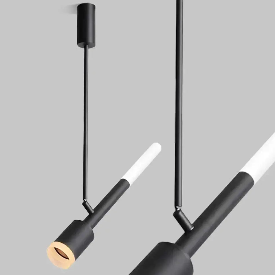 Modern black and white cob pendant spotlight with sleek cylindrical fixtures for living room lighting