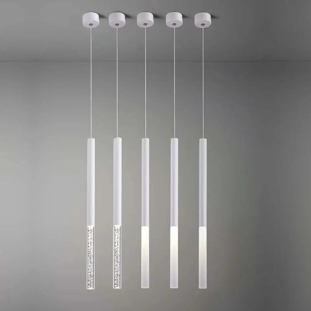 Five modern white pendant lights with frosted glass and crystal accents by decorbites cylinder led pendant for kitchen decor