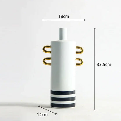 A modern white dots geometric ceramic vase with gold-toned handles and black-striped base for living room decor