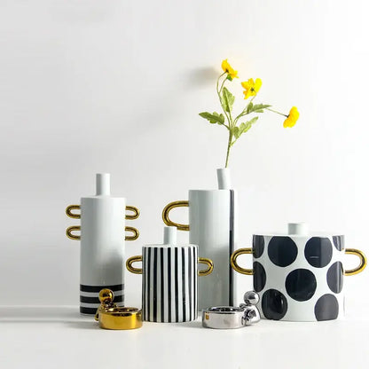 Modern black and white dots geometric ceramic vases with gold handles featuring bold stripes and white dots for living room decor