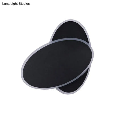 Modern black double oval wall sconce lamp with silver metallic trim for bedside bedroom lighting