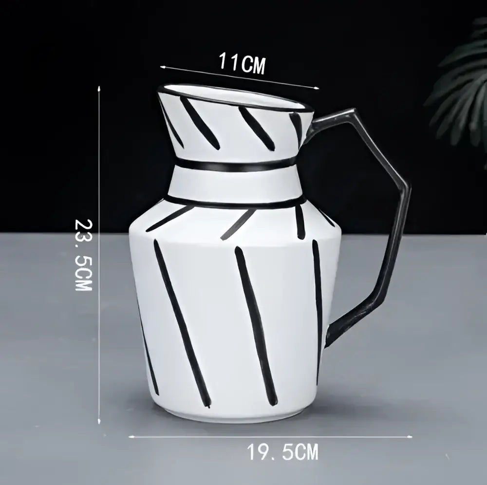 White ceramic pitcher with black geometric stripes and hexagonal handle for decorbites elegant striped ceramic vase decor