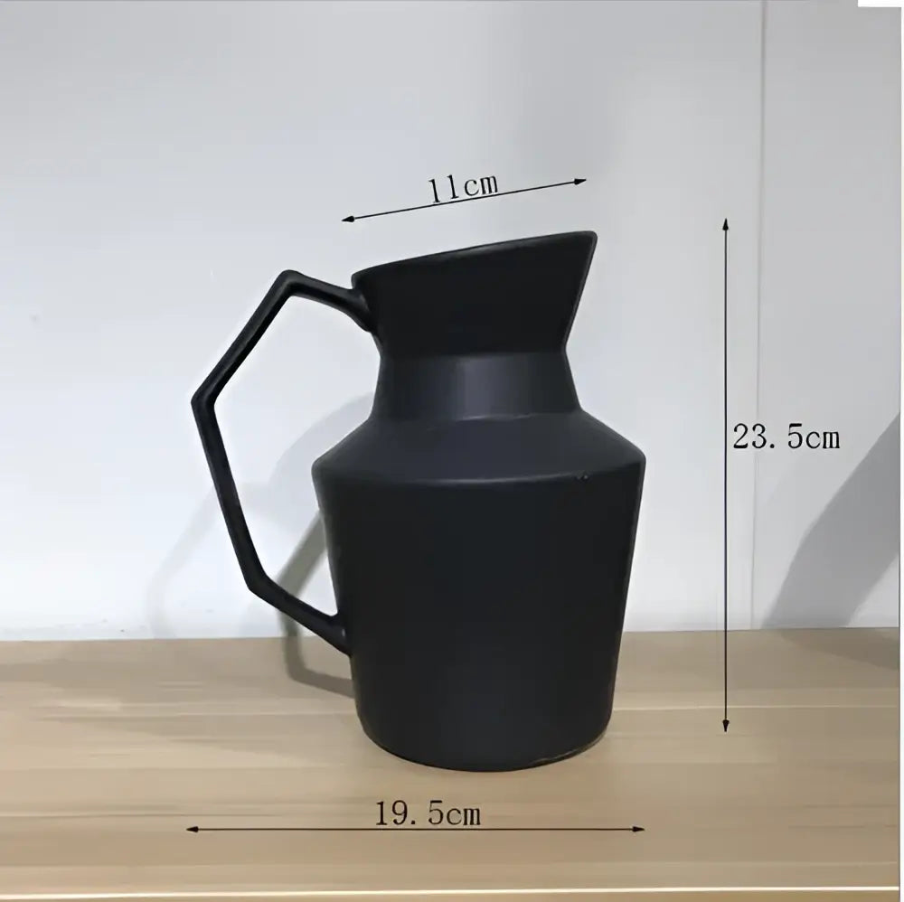 Black matte ceramic pitcher with hexagonal handle and geometric design for decorbites elegant striped living room decor