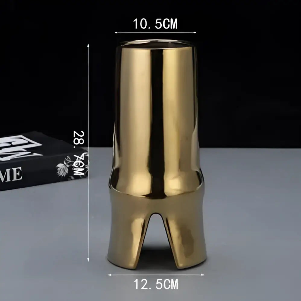 Golden ceramic vase with sleek bamboo design and reflective surface decorbites elegant striped ceramic living room decor
