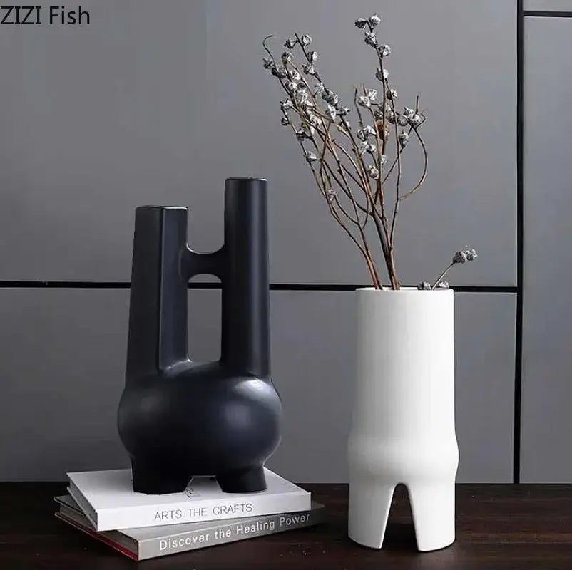 Modern black and white elegant striped ceramic vase with sculptural handle-like cutouts for living room decorbites decor