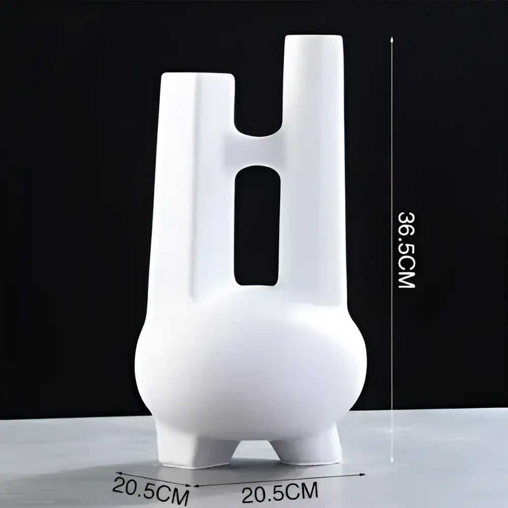 Modern black and white elegant striped ceramic vase with three slender tubes and vertical cutouts for decorbites elegant striped decor