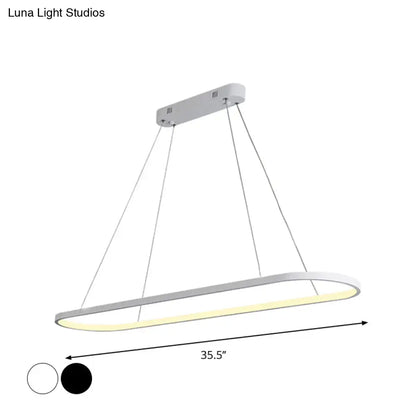 Modern white ellipse hanging lamp with warm yellow led glow from decorbites for dining table lighting