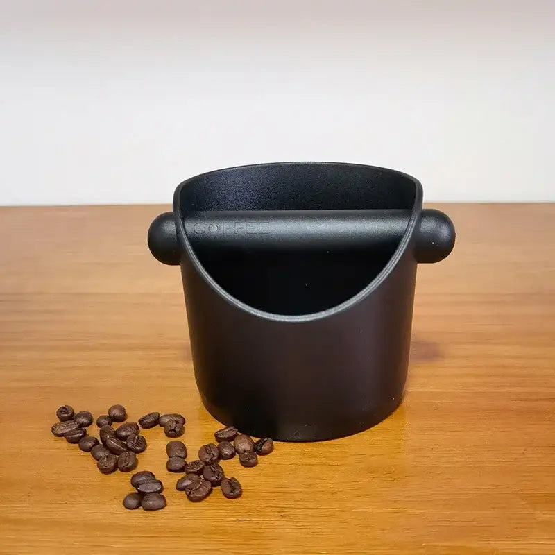 Black matte-finished coffee scoop with integrated handle and coffee engraving for decorbites espresso knock box use
