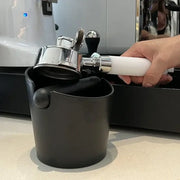 Modern black and white espresso knock box rubber portafilter holder with chrome accents for decorbites espresso knock use