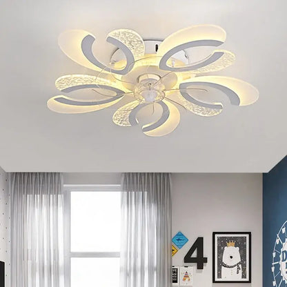 Modern black and white floral ceiling fan light with translucent petal arms emitting warm glow for living room use