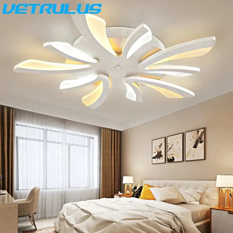 Modern black and white flower led chandelier with curved petals and warm yellow lighting by decorbites led chandelier