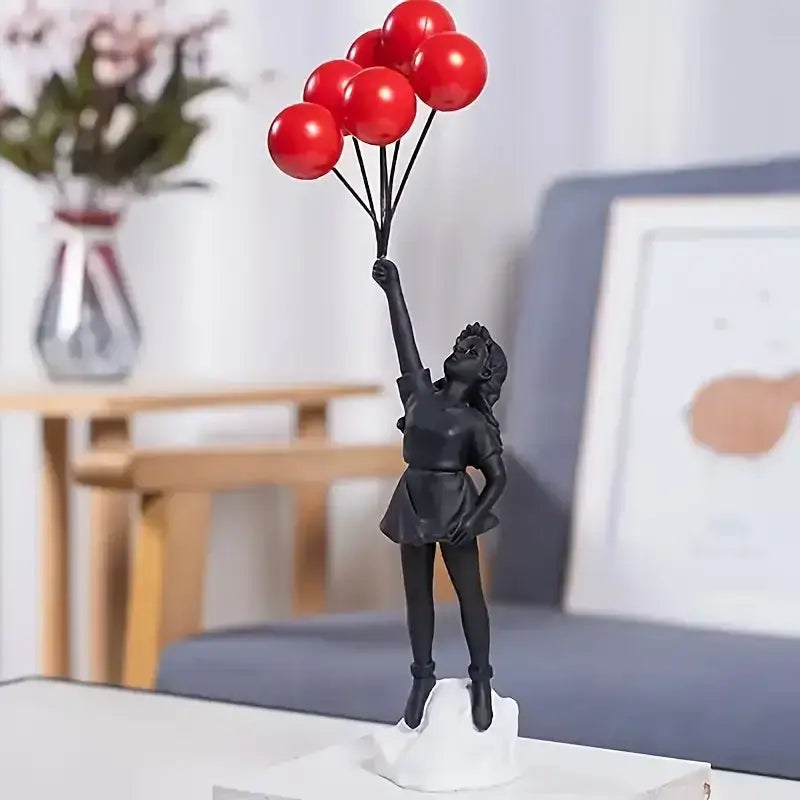 Modern black resin flying love balloon girl sculpture holding red balloons for living room decor by decorbites