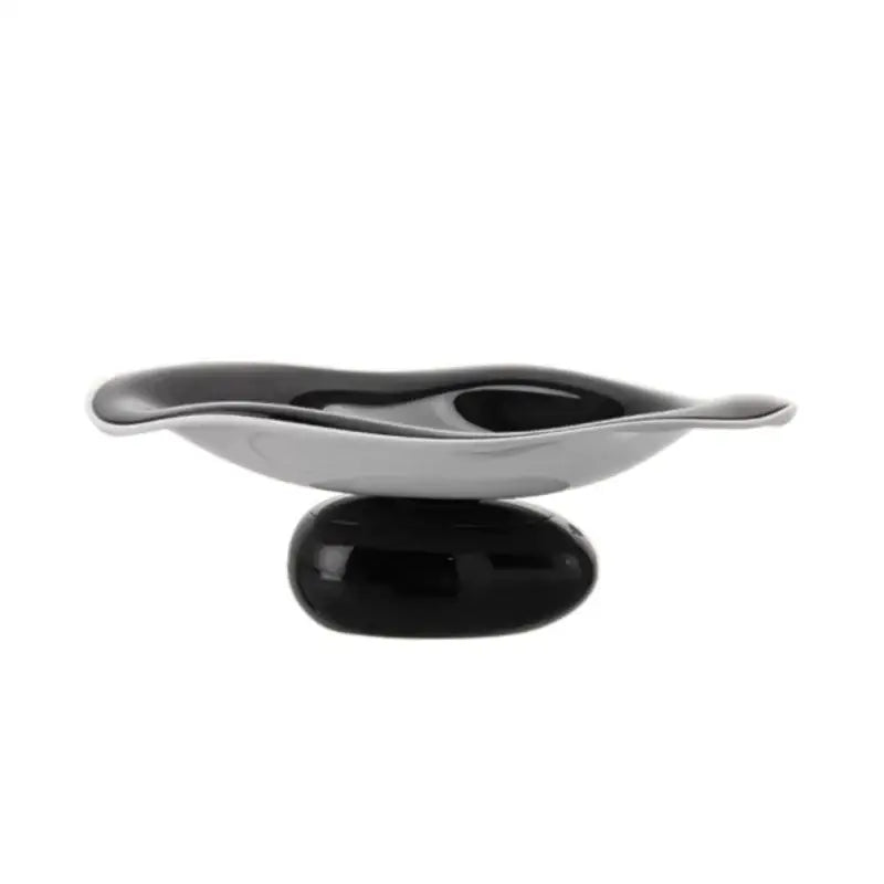 A sleek modern soap dish with a glossy black base and silver wave bowl complementing decorbites geometric acrylic fruit plate