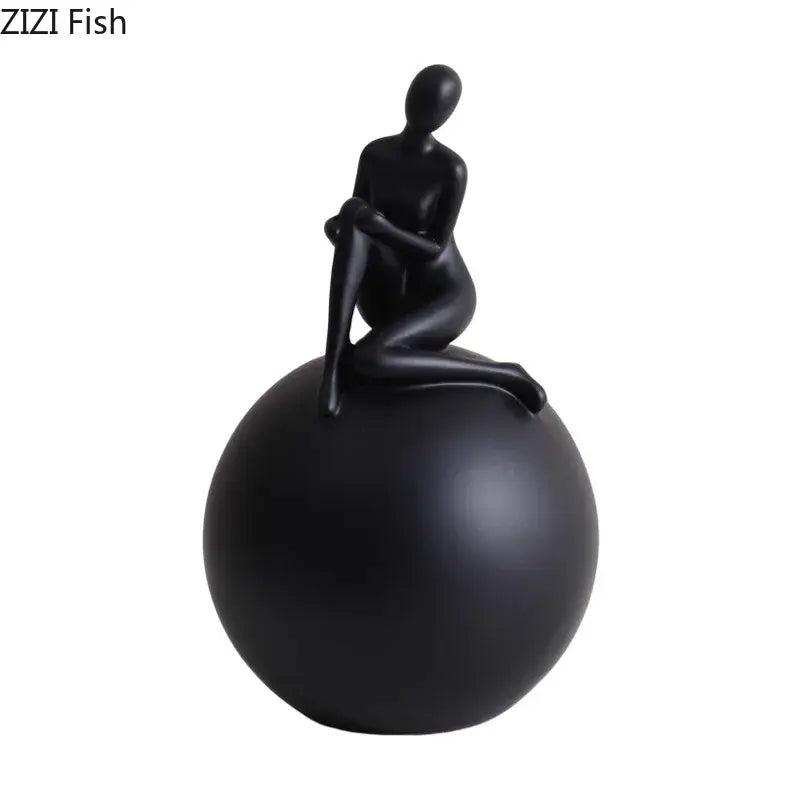 Modern black matte figurine of seated abstract human form on a decorbites geometric base character for living room decor