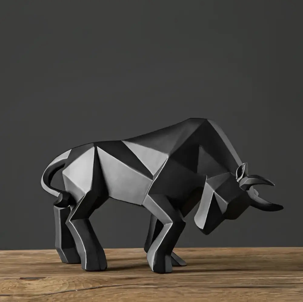 Modern black geometric bull sculpture with angular facets and matte finish for living room decor by decorbites