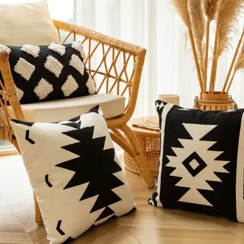 Modern black and white geometric embroidered cushion cover with textured details for living room use
