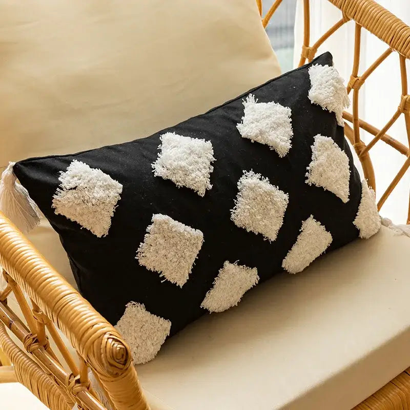 Modern black and white geometric embroidered cushion cover with fluffy tassel diamond appliqués and corner fringe