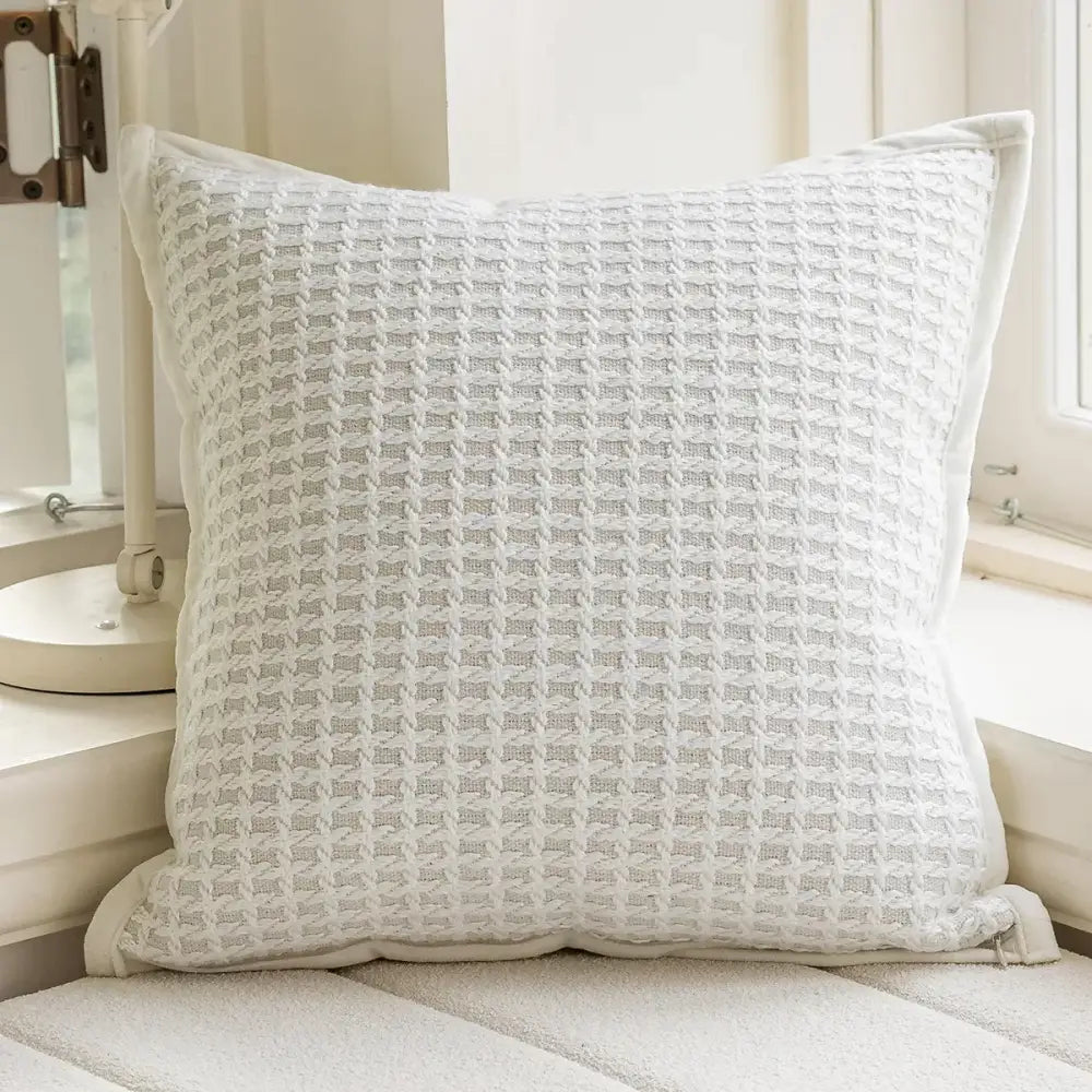 Modern black and white geometric jacquard cushion cover featuring a white square cushion with decorbites geometric jacquard pattern