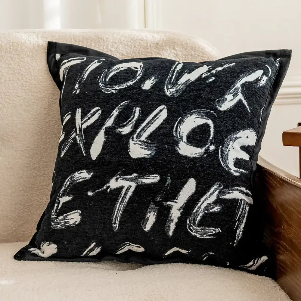 Modern black and white geometric jacquard cushion cover with bold white lettering for living room decorbites geometric jacquard cushion