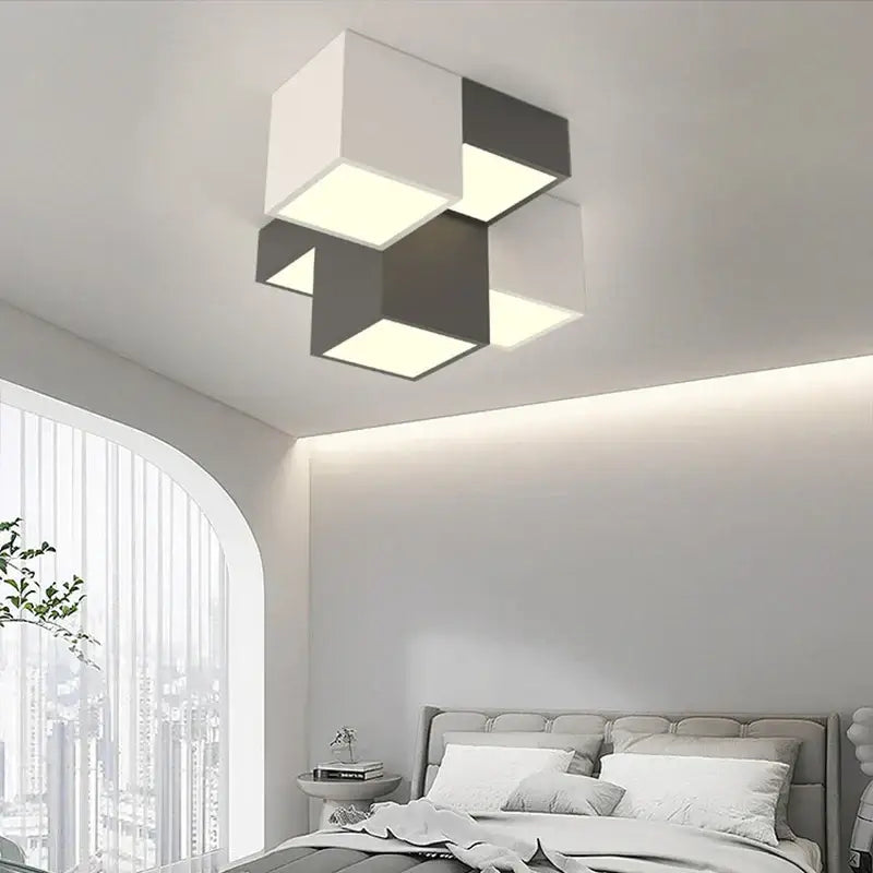Modern black and white geometric led ceiling light with interlocking cube panels for contemporary decorbites geometric led design