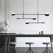 Modern black and white geometric line pendant lamp with gold accents for dining room decorbites geometric line design