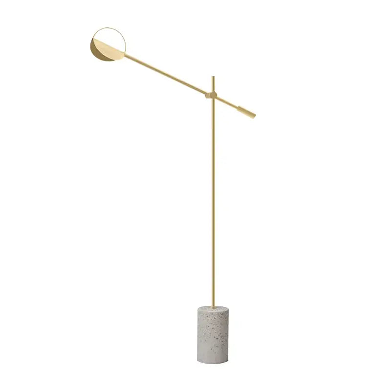Modern gold-toned floor lamp with circular head and concrete base complementing decorbites geometric line pendant lamp