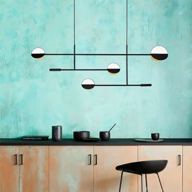 Modern black and white geometric pendant light made of decorbites geometric iron hanging above kitchen counter