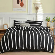 Modern black and white geometric stripes bedding set with vertically striped duvet cover and matching pillowcases by decorbites