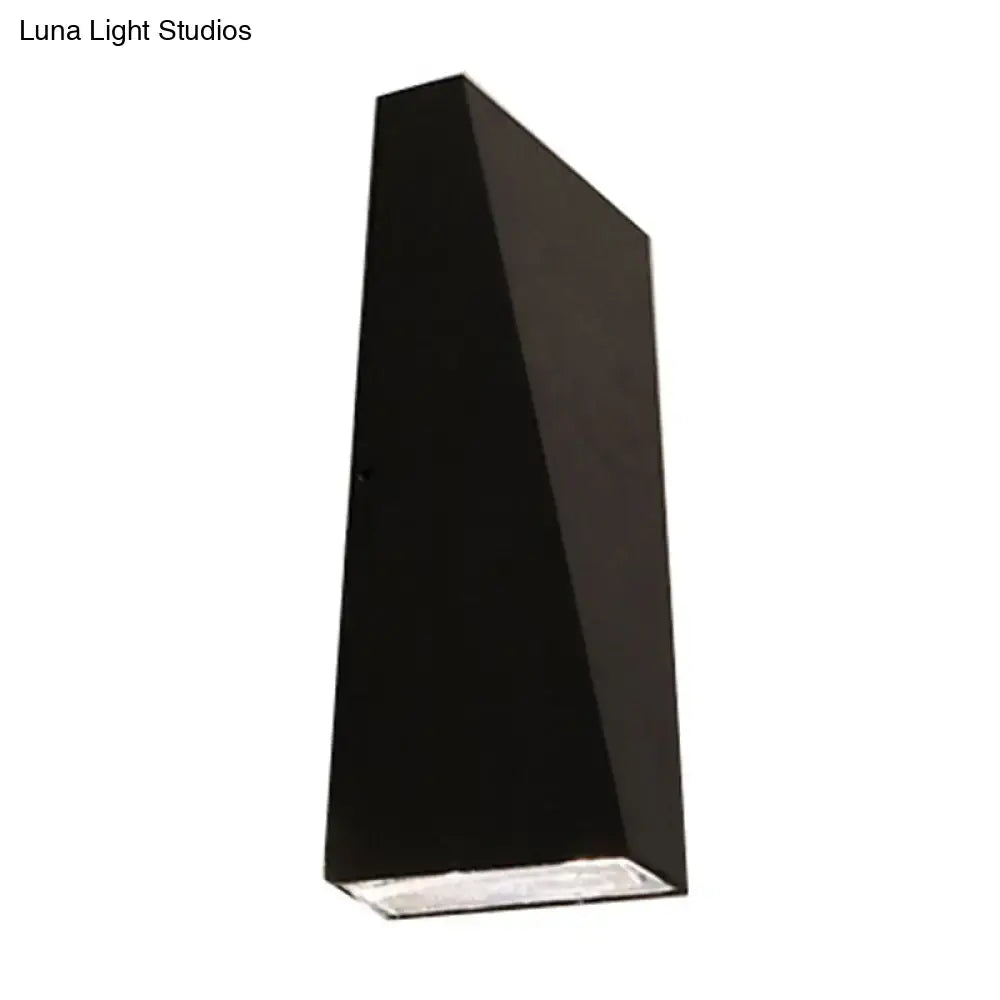 Modern black nord wall sconce with a sleek matte finish designed as a geometric wall lamp for bedroom use