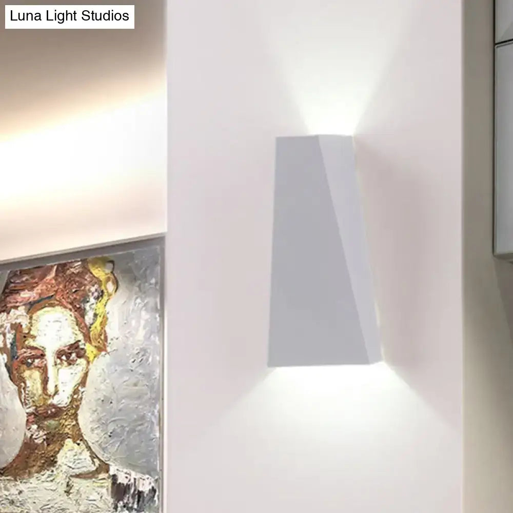 Modern black and white geometric nord wall sconce featuring a sleek angular design, ideal as a bedroom wall lamp