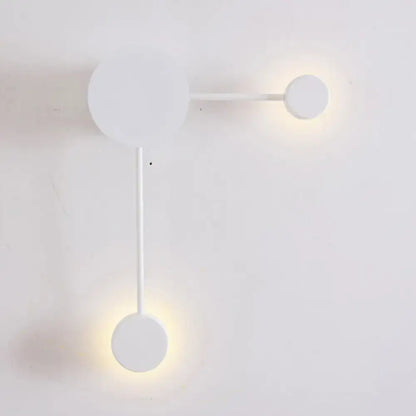 Minimalist black and white geometric wall sconce light fixture with three circular bulbs for living room wall light