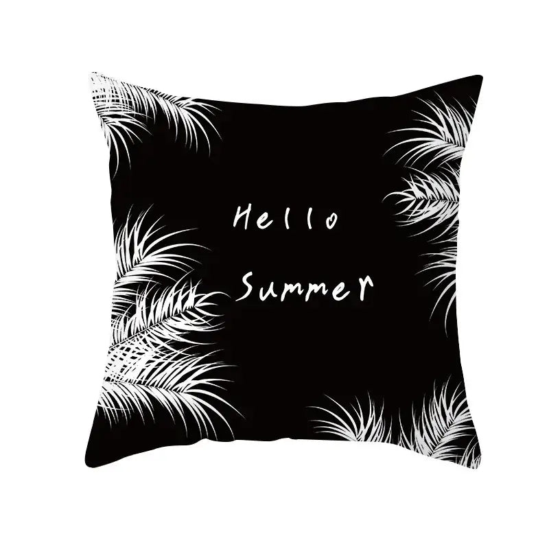 Modern black and white geometry letters cushion cover with black throw pillow featuring white palm leaf patterns and hello summer text for home decor decorbites black geometry black geometry letters