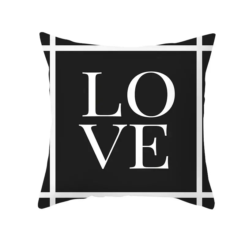 Modern black and white geometry letters cushion cover with bold white love lettering for home decor by decorbites black geometry