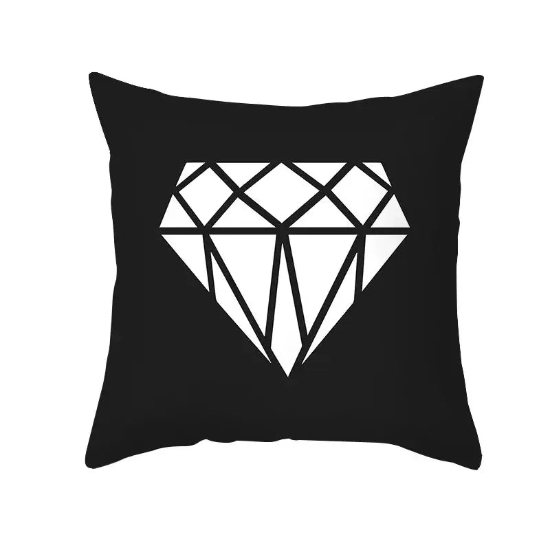 Black throw pillow with bold white geometric diamond design for modern home decor and decorbites black geometry style