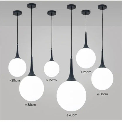 Modern black and white glass ball led pendant lights with sleek black metal stems for living room decorbites pendant lights