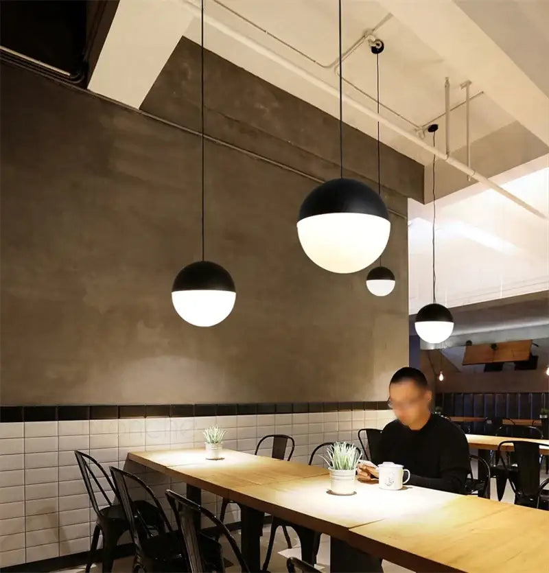 Black and white glass ball pendant lights by decorbites hanging from ceiling for modern kitchen decor