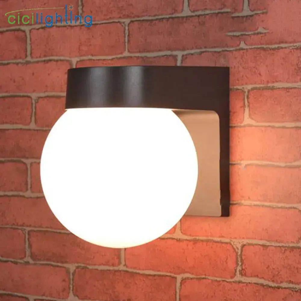 Modern black metal wall lamp with frosted white globe glass ideal for outdoor porch light and outdoor porch use