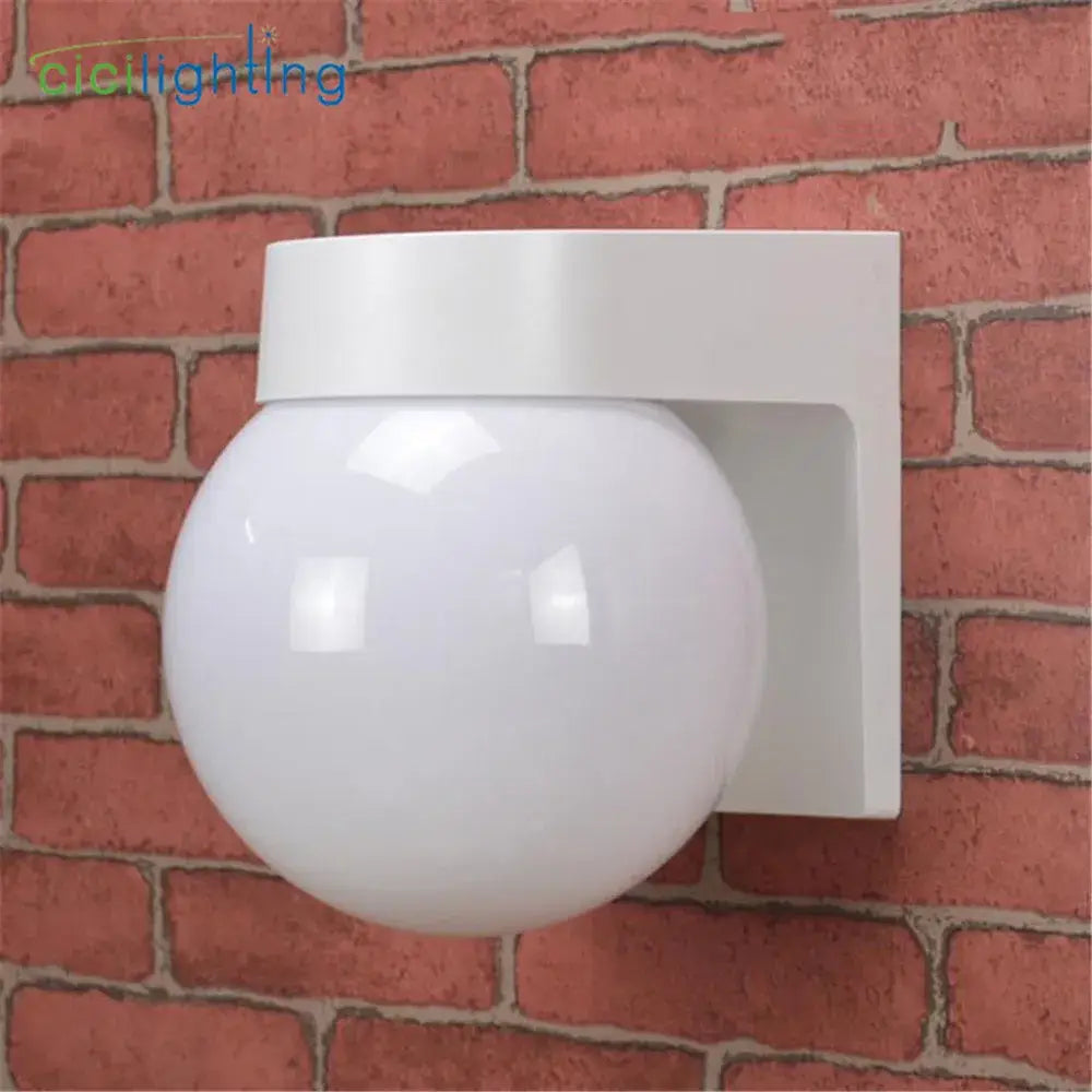 Modern black and white globe wall lamp with matte spherical light and geometric bracket for outdoor porch light