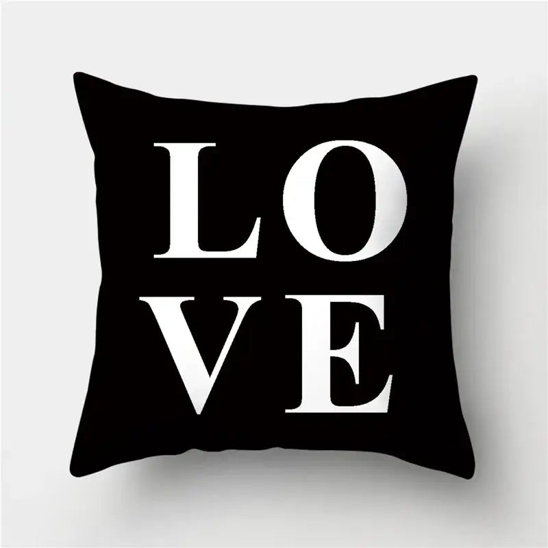 Modern black white and gold geometric stripes pillowcase featuring a black square pillow with bold white love lettering decorbites geometric stripes decorbites geometric