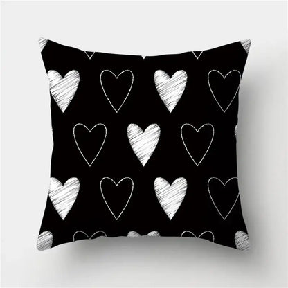 Modern black white and gold geometric stripes pillowcase with black throw pillow featuring white chalk-drawn hearts for decorbites geometric stripes decor