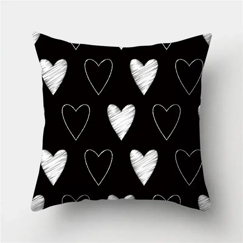 Modern black white and gold geometric stripes pillowcase with black throw pillow featuring white chalk-drawn hearts for decorbites geometric stripes decor