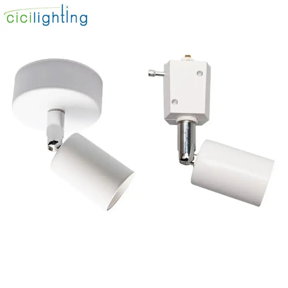 Modern black and white industrial ceiling light with white cylindrical spotlight fixtures and metallic mounting hardware